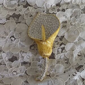 Elegant Gold and Silver Floral Brooch